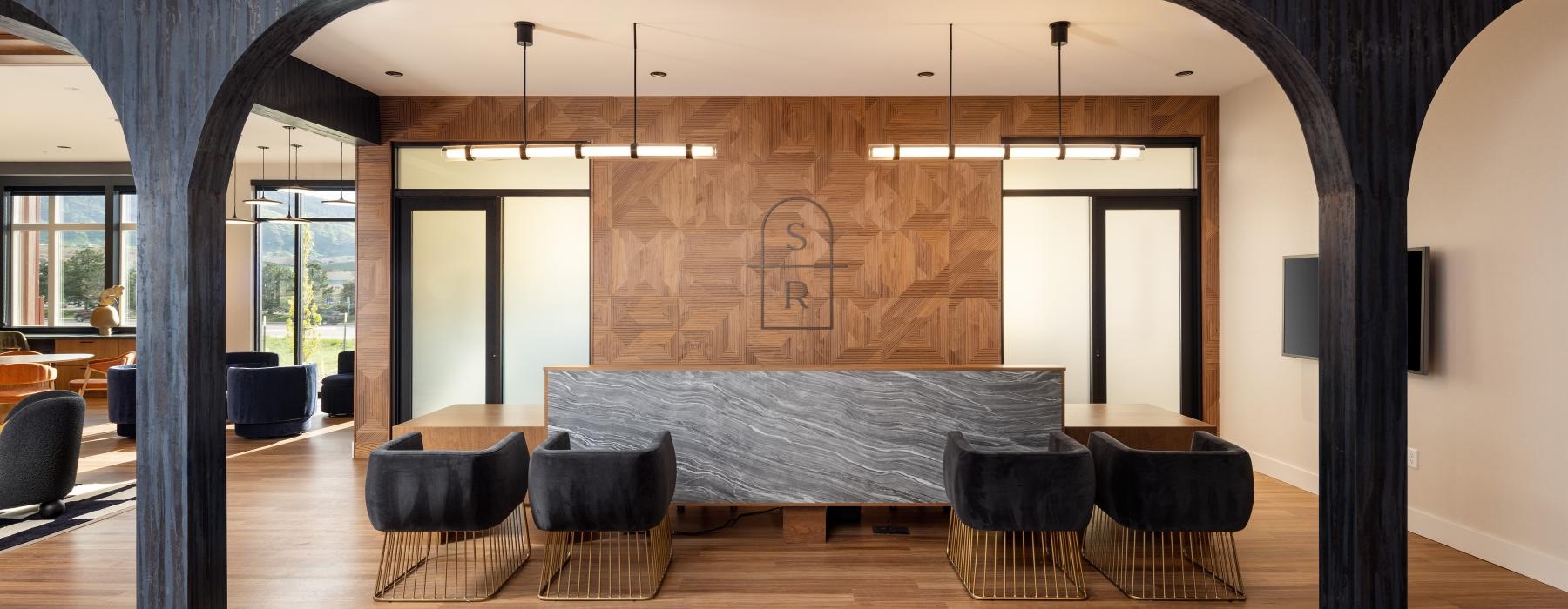 Lobby with seating and wooden accents in our Littleton, CO apartments for rent.